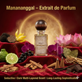 Perfume bottle labeled 'Mananangal' with flowers, fruits, and incense on a red fabric background.